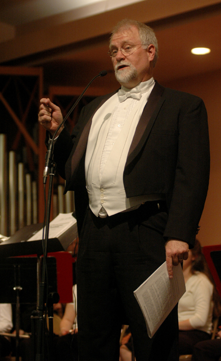 Conductor David McClune addresses the audience during a Symphonic Band performance. - Photo by Brad Moore