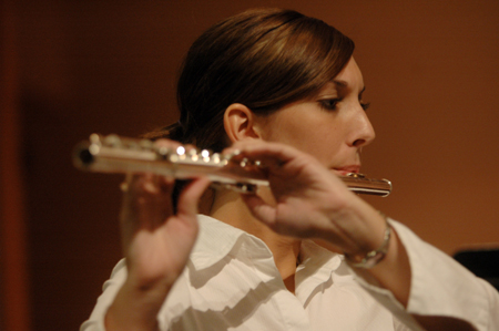 Junior Rebecca Wiggins plays her flute during a Symphonic Band performance. - Photo by Brad Moore