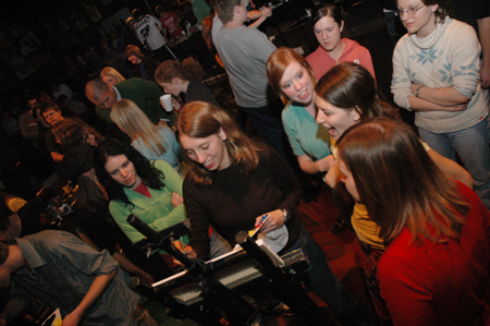 Senior Heather Couch paints during an interlude at Cafe Bongo. - Photo by Brad Moore