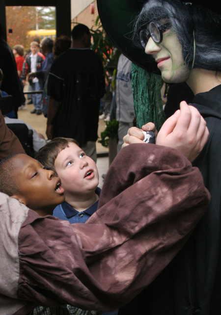 Audience members examine Kyle Raines' makeup after a performance of <i>Hansel and Gretel</i>. - Photo by Kyle Kurlick