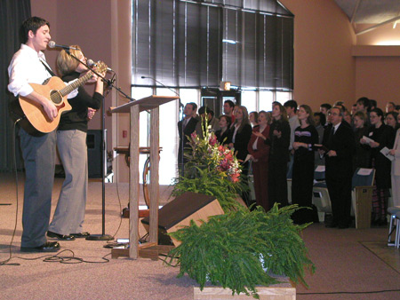 Steve Moore and Kristin Wicker lead in worship before Heather Mercer and Dana Curry speak.
 - Photo by Cam Tracy