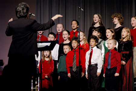 Betty Bedsole led the children's choir from the Community Music Center during <em>A Union Christmas</em>. - Photo by Brad Moore