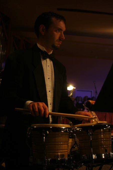 Adam Wood played the bongos during <em>A Union Christmas</em>. - Photo by Kyle Kurlick