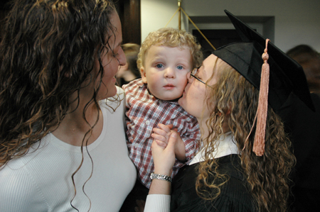 Courtney Evans says goodbye to family before joining her fellow graduates at fall graduation. - Photo by Brad Moore