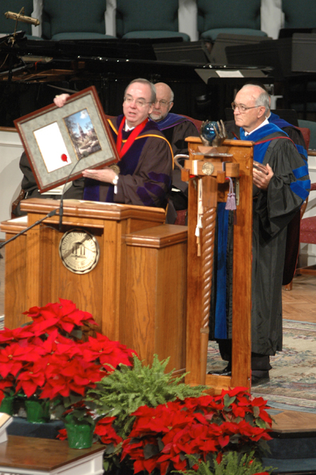 President Dockery (left) presents Bob Agee with the annual Robert E. Craig Service Award during fall graduation. - Photo by Brad Moore