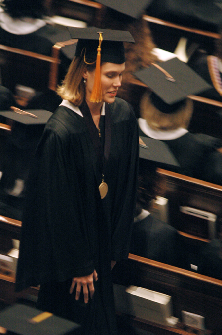 Wendy Bradshaw makes her way to the stage to receive her diploma during fall graduation. - Photo by Brad Moore