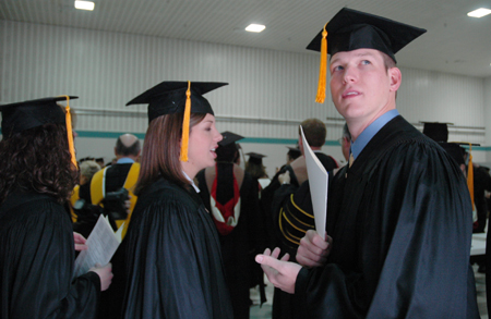 Julie Smith & Seth Silcock chat before marching into the sanctuary during fall graduation. - Photo by Kristen Nicole Sayres