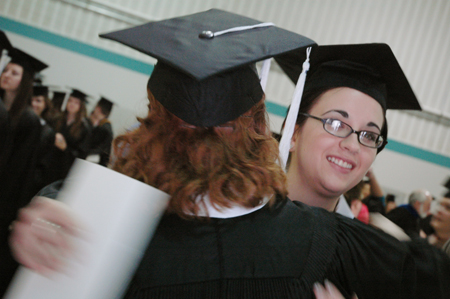 Sharon Hart hugs friend and roommate Kathleen Murray shortly before December graduation ceremonies. - Photo by Kristen Nicole Sayres