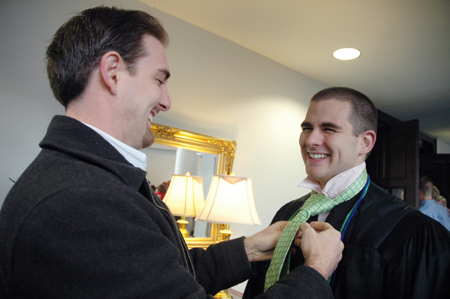 Union alum Nick Ellis helps his brother Ian prepare for the fall graduation ceremony. - Photo by Kristen Nicole Sayres