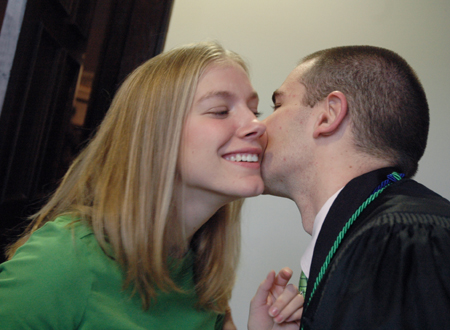Ian Ellis kisses his fiance Crystal Kinser before his graduation. - Photo by Kristen Nicole Sayres