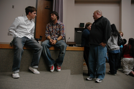 Freshman Matt Elia speaks with one of the filmmakers after the Union showing of <em>Invisible Children</em>. - Photo by Kristen Nicole Sayres