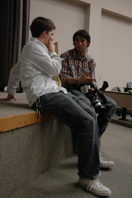 Freshman Matt Elia speaks with one of the filmmakers after the Union showing of <em>Invisible Children</em>. - Photo by Kristen Nicole Sayres