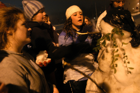 Candra Pennington, Katrina Parker, Kayli Anthony and friends make a snowman. - Photo by Heather Phillips