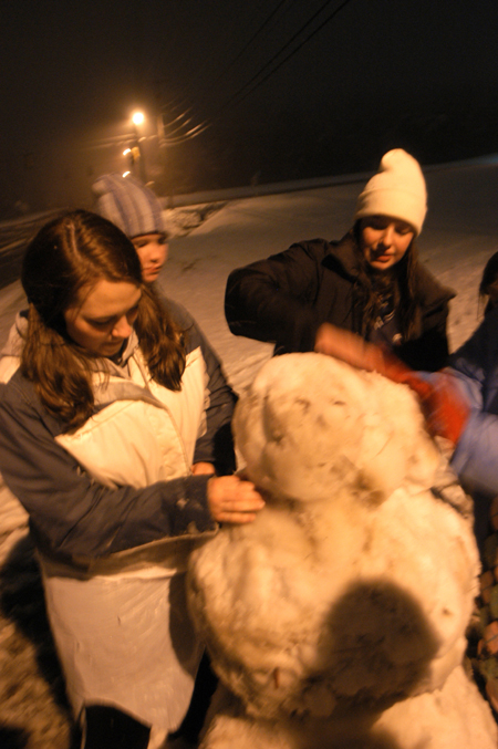Kristin Jennings, Katrina Parker and Emily Blackketter make a snowman. - Photo by Heather Phillips