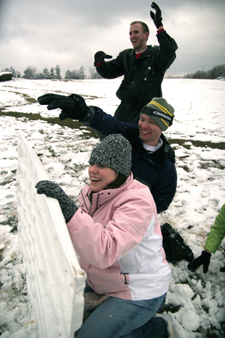 Brittany Sampson, Brian Burns and John Henson  launch some snowballs at their friends. - Photo by Kyle Kurlick
