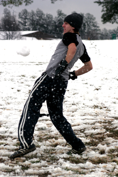 Drew Winter evades incoming snowballs during a snowball fight. - Photo by Kyle Kurlick
