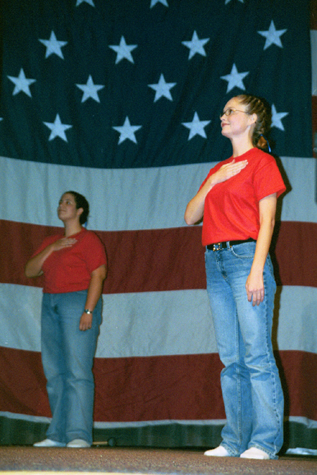 English major Erin Hetzel and Accounting major Sherryl Schrock participate the junior class' patriotic act during the SAC Variety Show. - Photo by Lindsay Stavish