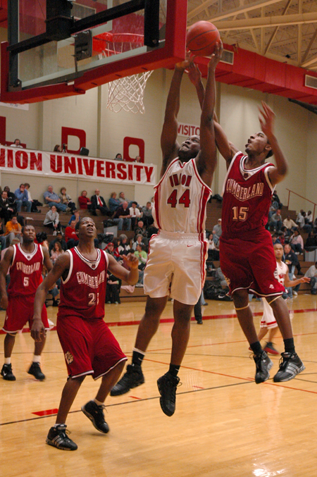 Pierry Valmera leaps high for a rebound in a Union win over Cumberland. - Photo by Brad Moore