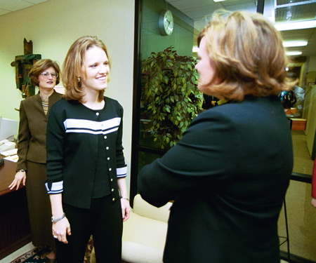 Heather Mercer talks with Union Provost Carla Sanderson before the chapel service. - Photo by Jim Veneman