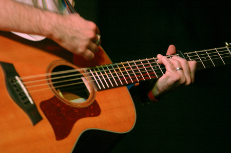 INO recording artist Derek Webb performs at the Homecoming Coffeehouse.  Many of his songs incorporate imagery of the Church being the Bride of Christ. - Photo by Brad Moore