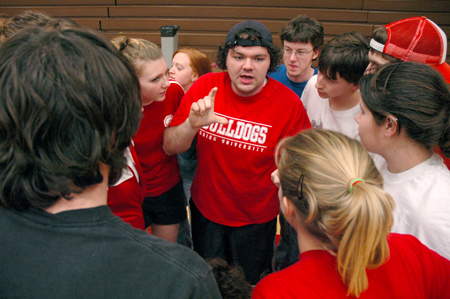 Josh Clarke discusses strategy with his fellow Sophomores before the Wild and Wacky Homecoming Games begin. - Photo by Brad Moore