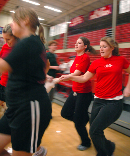 A group of Chi Omegas race across the gym in a Wild and Wacky Homecoming Game. - Photo by Brad Moore