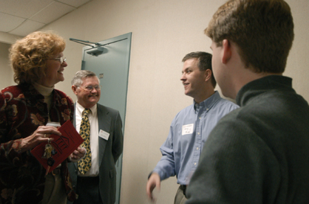 Carol Leslie, Giley Wright, Kerri Ross and Kent Willis fellowship before the Alumni Conference on the Sciences, an annual Homecoming event. - Photo by Heather Phillips