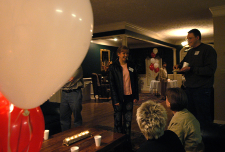 Computer science alums gathered at the LXA house during Homecoming 2006. Emily Dunn and Oliver Dossman are pictured here. - Photo by Heather Phillips