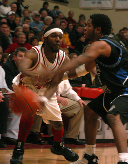Marcus Cooper makes the pass while being closely guarded by a Mountain State defender.  - Photo by Heather Phillips
