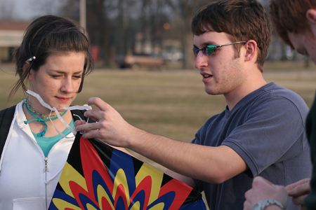 Lindsey Abell and David Hancock prepare a kite to fly on a warm and windy February day at Union. - Photo by Kyle Kurlick