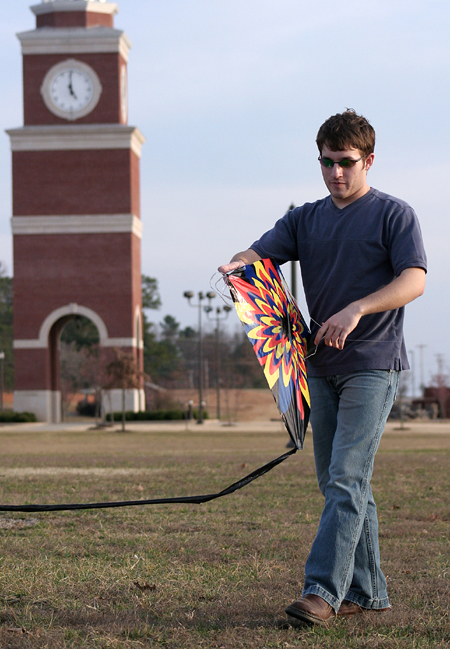 David Hancock prepares to fly his kite on a warm and windy February day at Union - Photo by Kyle Kurlick