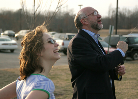 Dr. Richard Joiner, chair of the music department, joins Hannah Smith in kite flying outside of Jennings Hall. - Photo by Kyle Kurlick