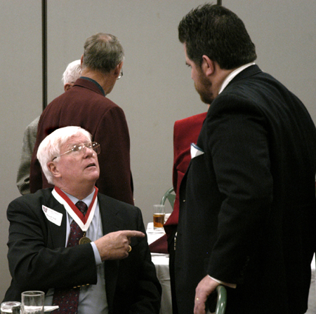 Cristian Murdock fellowships with Russell Tuck, a member of the Class of 1956, during his 50-year reunion luncheon at Homecoming 2006. - Photo by Stephanny Rodriguez