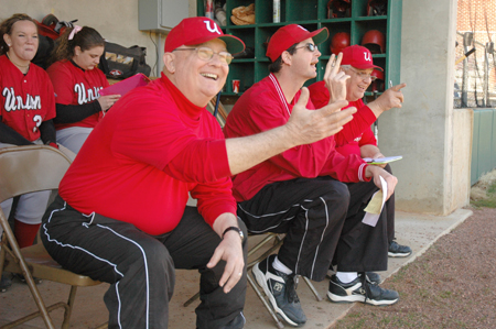David Blackstock, in his first season as head coach of the softball team, along with his assistant coaches Steven Gream and Carlo Spencer get a laugh during a game at Union's Fesmire Field. - Photo by Brad Moore