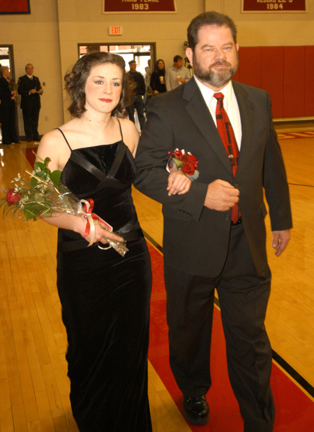Junior Lindsey Abell, a learning foundations major from St. Louis, Mo., is escorted by her father Charles Abell in the Homecoming Court processional.  - Photo by Morris Abernathy