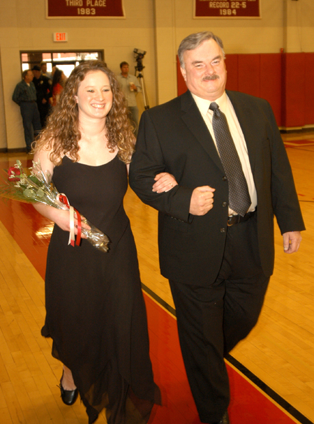 Senior Kathleen Lokey, a social work major from Columbia, Tenn., is escorted by her father Mike Lokey in the Homecoming Court processional. - Photo by Morris Abernathy