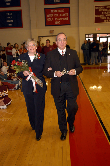 David and Lanese Dockery bring in the homecoming queen crown during the Homecoming Court processional. - Photo by Morris Abernathy