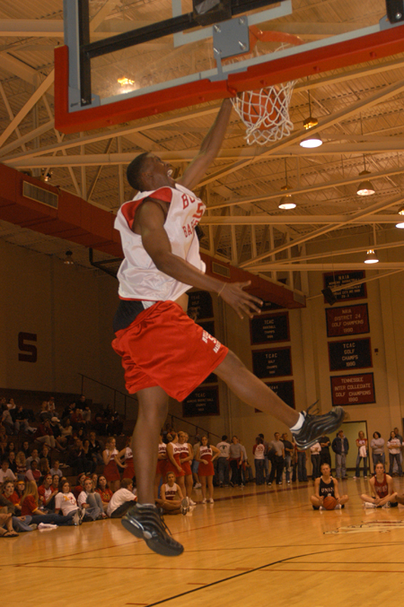 Walk-on Anthony Irons takes his turn in the dunk contest during Midnight Madness. - Photo by Jim Veneman