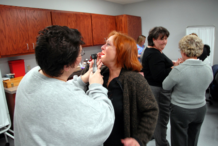 Instructors Kat Cooper and Pat Keene (background) facilitate a medical exam class for the RN-BSN program on the Germantown campus. - Photo by Morris Abernathy