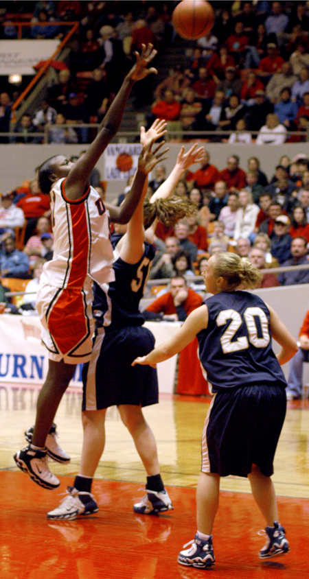 Freshman center Josephine Owino (51) takes a shot over a Master's defender in Union 62-51 semifinal win in the NAIA National Tournament. - Photo by Brad Moore