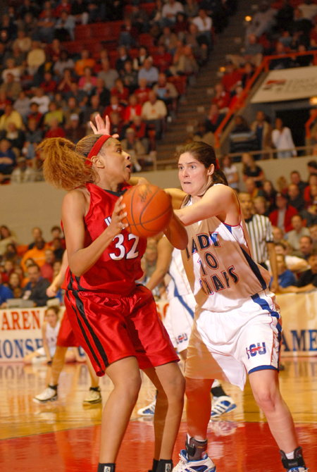 Natanya Smith (32) makes a move against the Lubbock Christian defense during the NAIA Women's Basketball National Championship Game.  - Photo by Morris Abernathy