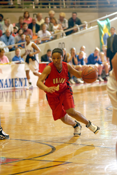 Jessica Graves (4) drives the lane during the NAIA Women's Basketball National Championship Game.  - Photo by Morris Abernathy