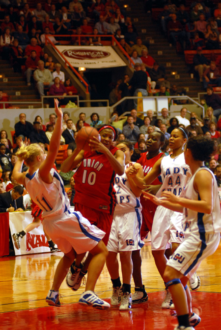Ena Daniels (10) charges into the paint during the NAIA Women's Basketball National Championship Game.  - Photo by Morris Abernathy