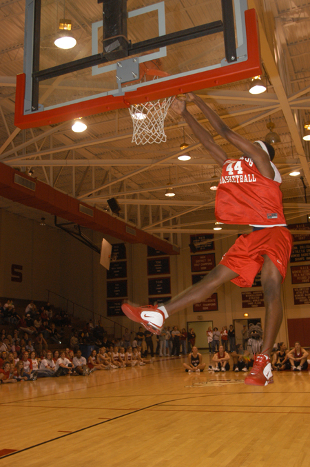 Freshman Pierry Valmera gives his best attempt in the dunk contest. - Photo by Jim Veneman