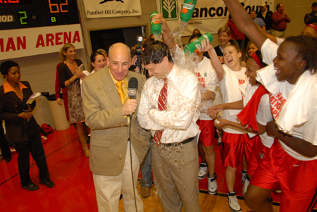 The Union Lady Bulldogs douse their head coach Mark Campbell in celebration of a second consecutive NAIA national championship. - Photo by Morris Abernathy