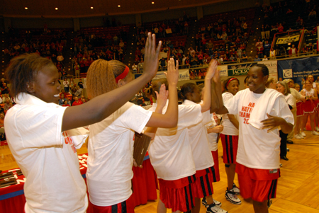 Freshman Josephine Owino and the Lady Bulldogs line up to receive national championship accolades after their 2006 victory over Lubbock Christian at Oman Arena. - Photo by Morris Abernathy