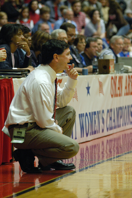 Head Coach Mark Campbell gives encouragement from the sidelines during the NAIA Women's Basketball National Championship Game.  - Photo by Jim Veneman