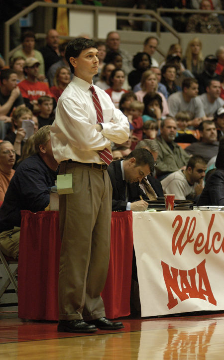 Head Coach Mark Campbell stares down a referee during the NAIA Women's Basketball National Championship Game. - Photo by Jim Veneman
