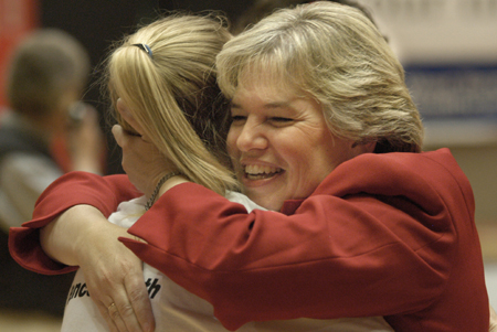 Union's first lady Lanese Dockery congratulates sophomore guard Crystal Eason on winning a second consecutive NAIA national championship. - Photo by Jim Veneman