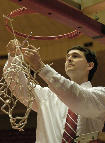 Head coach Mark Campbell finishes 2005-2006 cutting down the nets after a second consecutive NAIA national championship. Campbell is among the most successful coaches at any level, compiling 226 wins in just seven seasons. - Photo by Jim Veneman